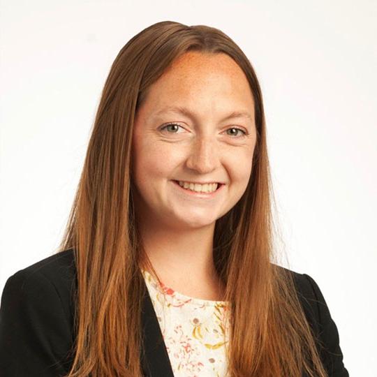 headshot of woman with long brown hair